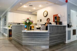 smiling nurses at a nurses station