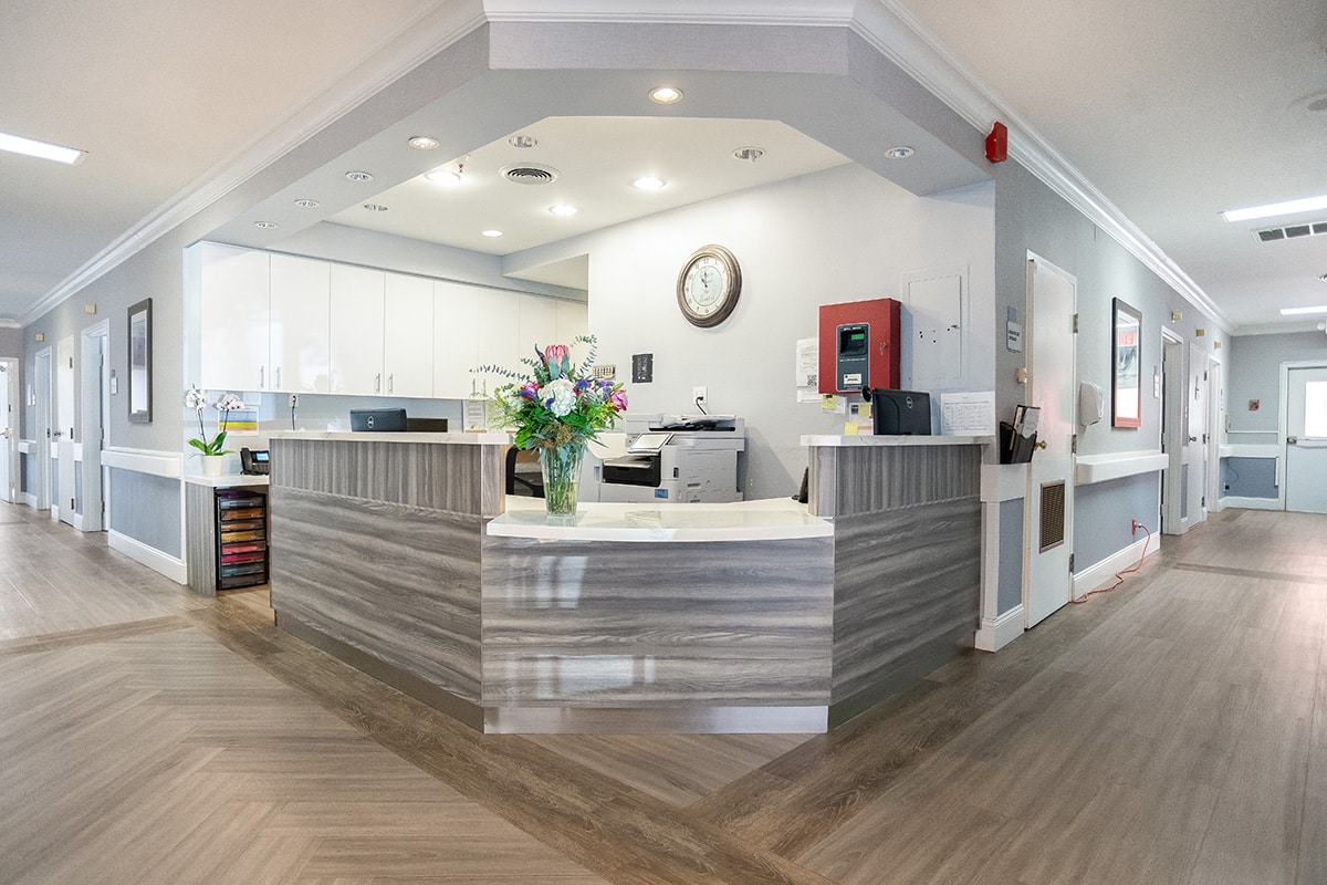 smiling nurses at a nurses station